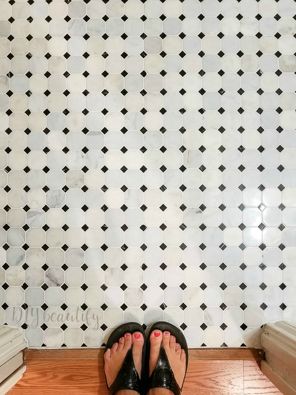 I'm revealing our small bathroom that we made over with products provided by Lowe's to add big farmhouse style! Come see it at DIY beautify! #farmhouse #bathroom #roommakeover #Lowes black and white stone tile